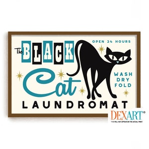 May include: A vintage-style illustration of a black cat with the text "The Black Cat Laundromat" and "Open 24 Hours" in a brown frame. The text "Wash Dry Fold" is also included.