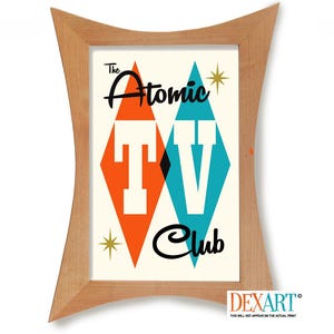 May include: A framed print with a mid-century modern design. The artwork features the words "The Atomic TV Club" with orange and teal diamond shapes. The frame is made of light-colored wood.