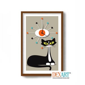 May include: A black and white cat with yellow eyes sits in front of a mid-century modern clock with orange and blue accents. The clock is a stylized eye with spokes radiating out from the center.