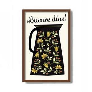May include: A framed print with a black pitcher with a floral pattern in yellow, green, and red. The text "Buenos días!" is written in black cursive at the top of the print.