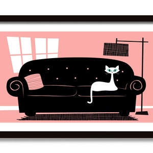 May include: A black couch with a white cat sitting on it. The couch is in a room with a pink wall and a window. There is a floor lamp in the corner of the room.