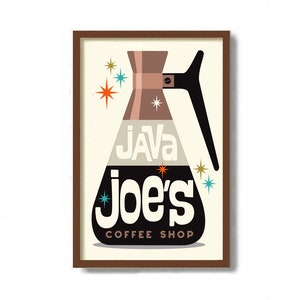 May include: A framed rectangular wall art print featuring a stylized coffee carafe graphic. The design includes the text "JAVA" and "joe's COFFEE SHOP" in white and black lettering, accented by colorful starburst shapes on a cream background.