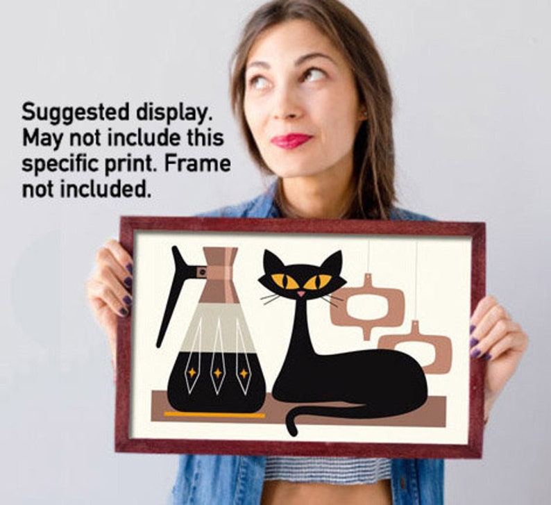 May include: A mid-century modern style print featuring a black cat with yellow eyes, a coffee pot, and abstract shapes in shades of brown, beige, and black.