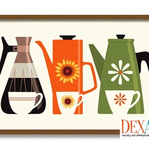 May include: A framed print featuring three stylized coffee pots in orange, green, and a glass carafe. The orange pot has a sunflower, the green pot has a daisy, and each has a matching cup. The print is on a cream background.