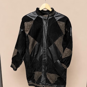 Vintage patchwork leren bomberjack: geometrische zwart-bruine statementjas uit de jaren 80/90