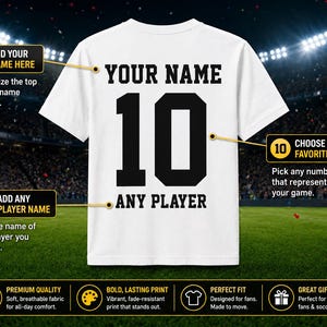 May include: White t-shirt with black text and numbers, featuring "YOUR NAME" above the number "10" and "ANY PLAYER" below. The shirt design allows for personalization of name and number. The shirt is displayed on a green field.