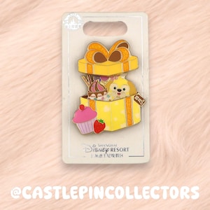 May include: A white ceramic mug with a black handle and the text "But First, Coffee" in a black, handwritten-style font. The mug is on a white surface.