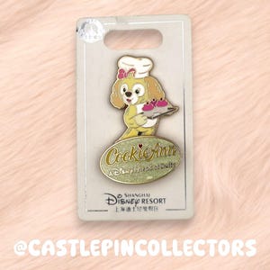 May include: A set of three ceramic mugs with a speckled, matte finish. The mugs are in shades of cream, light gray, and dark gray. Each mug has a simple, minimalist design and a rounded handle.