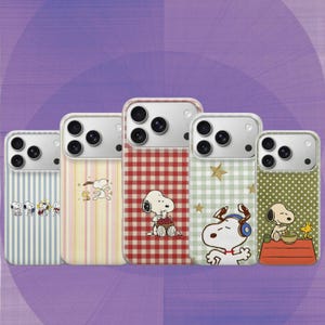 May include: Five phone cases with Snoopy designs. The cases feature various patterns, including stripes, gingham, and polka dots, with Snoopy illustrations. The cases have a clear border and a camera cutout.
