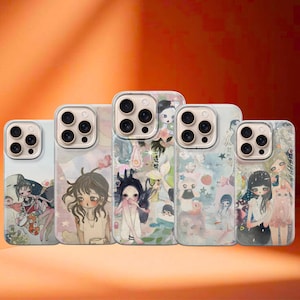 May include: A collection of five phone cases with unique illustrations. Each case features a different whimsical design, including drawings of girls, flowers, and other artistic elements. The cases have a clear border and a glossy finish.