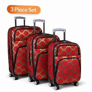 May include: A three-piece luggage set. The rolling suitcases are red with a gold geometric pattern. Each piece has a black trim, a retractable handle, and wheels. The set is labelled "3 Piece Set".