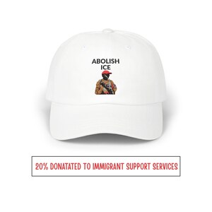May include: White baseball cap featuring the text "ABOLISH ICE" and an illustration of a person in military attire. The bottom of the image has the text "20% DONATATED TO IMMIGRANT SUPPORT SERVICES".