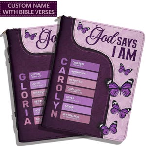 May include: A purple rectangular Bible cover featuring the text God says I am and a custom name vertically displayed. The design includes multiple purple butterflies and a list of words with corresponding Bible verses printed on the front surface.