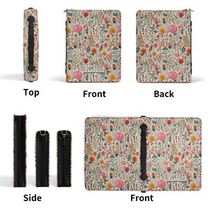 May include: A rectangular zippered case featuring a cream background with a colorful wildflower pattern. The front displays the name Isabella in white script. The case includes a black handle, black side panels, and a zipper closure mechanism.