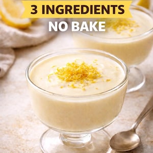 May include: Two glass dessert cups filled with lemon posset, topped with lemon zest. The image includes text that reads "Lemon Posset, 3 Ingredients, No Bake" and "French Sweet Atelier". A spoon and lemon slices are also visible.