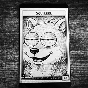 May include: Black and white illustration of a squirrel with a wide grin, featured on a card. The word "SQUIRREL" is printed at the top, with "1/1" at the bottom. The squirrel has large, droopy eyes and detailed fur.