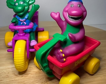 Vintage Barney in Red Wagon and Baby Bop on Purple Trike 1998