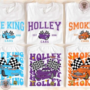 a collection of white T-shirts with various car-related designs and text.
