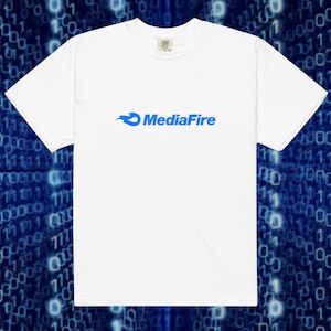 May include: A white short-sleeved t-shirt featuring the blue MediaFire logo printed on the center of the chest. The logo consists of a stylized blue flame icon positioned to the left of the blue text MediaFire in a bold sans-serif font.