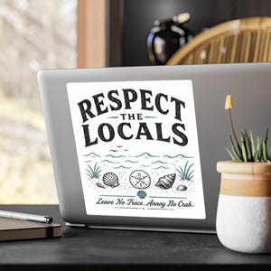May include: A rectangular white sticker featuring the black text RESPECT THE LOCALS above a teal ocean illustration with seashells and a sand dollar. Below the illustration, the text reads Leave No Trace. Annoy No Crab. in black.