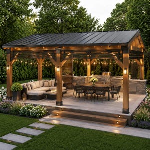 May include: A wooden outdoor pavilion with a dark metal roof, featuring a stone kitchen island with a grill, a dining table with six chairs, and a sectional sofa with a fire pit table. The structure is illuminated by wall sconces and string lights.
