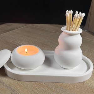 Pure white tealight holder with lid and match holder on an oval trinket tray. Beautiful curved shapes. Handmade in the UK using eco-resin