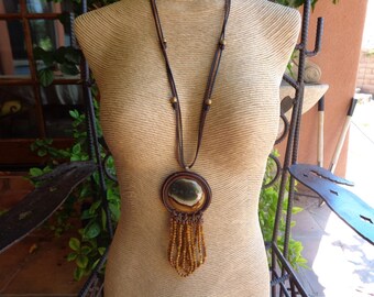 A Long Hanging Jasper and Leather Pendant With Faceted Tigers Eye Loop Dangles