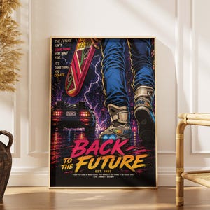 May include: A framed poster featuring the movie "Back to the Future." The artwork depicts a person in blue jeans and sneakers with a skateboard, the DeLorean car, and the text "Back to the Future" in a vibrant, colorful design. The poster includes the quote "Your future is whatever you make it, so make it a good one."