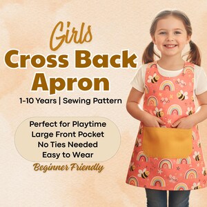 May include: A young girl wearing a coral-colored cross-back apron with a yellow front pocket. The apron features a pattern of rainbows and bees. Text on the image reads "Girls Cross Back Apron 1-10 Years | Sewing Pattern".