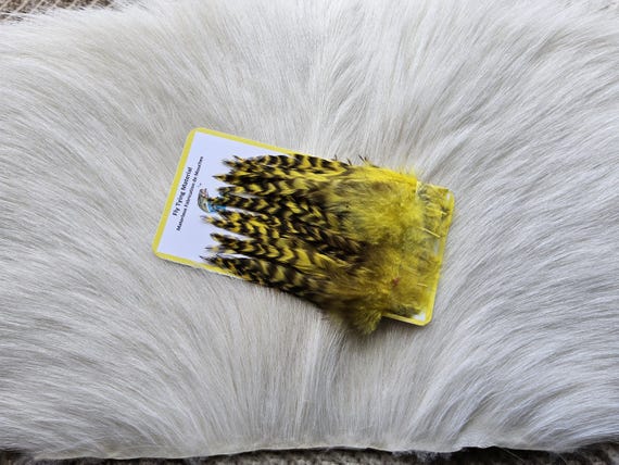 Fly Tying Feather. Select Schalpen Saddle Hackle (Feather)  (50) Per Plastic Bag. Color; Yellow Grizzly.
