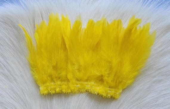 Schalppen Saddle Hackle.. Fly Tying Feather. Schalppen Hackle (Feather) 6" Strip, 15 cm... Color;  Yellow H-36