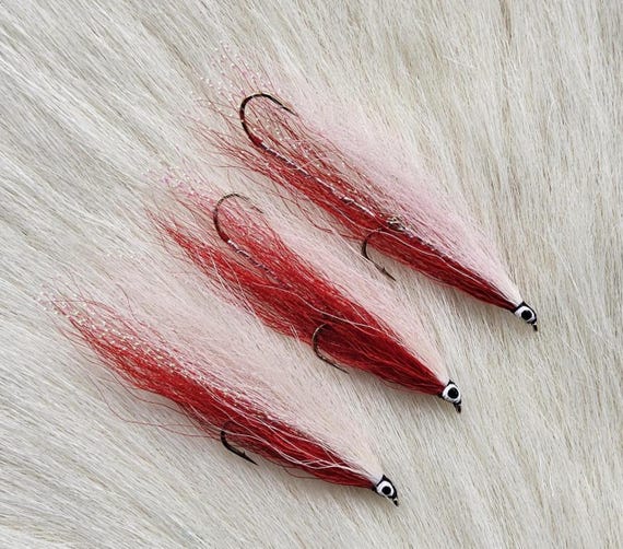 Streamer Fly.  Fishing Flies. Comes with Trolling Hooks. . Our Most Popular , Red & White Bucktail.. (3) Fly Combo.. Size #4-6and 4 Single.