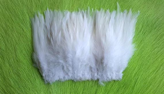 Fly Tying Feather. Saddle Hackle (Feather) 6" Strip, 15 cm... Color;  Bleach White,