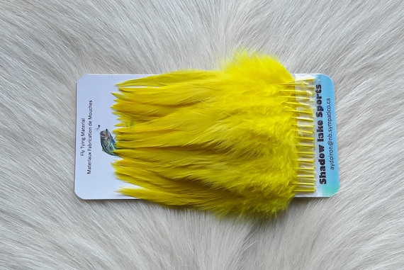 Fly Tying Feather. Select Schalpen Saddle Hackle (Feather)  (50) Per Plastic Bag. Color; . Yellow.