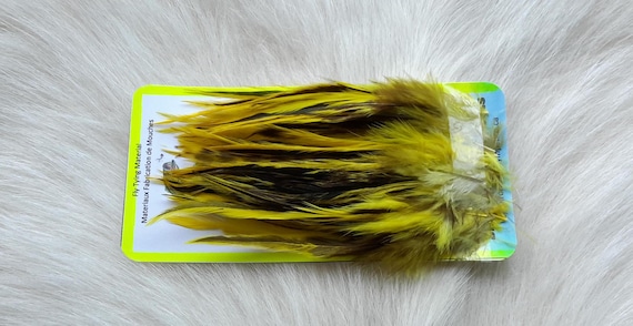 Fly Tying Feather. Select Schalpen Saddle Hackle (Feather)  (50) Per Plastic Bag. Color; . Badger, Yellow..