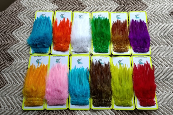 Fly Tying Feathers..  Super Special....  (12)  packs  Strip of Mix Strung Saddle Hackle Feather,,  Asst. Colors...