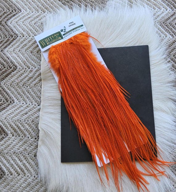 Whiting Saddle Hackle.  Dry Fly Rooster Full Saddle,, Color,  Dyed Orange ..   Free Shipping. From Canada