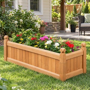 May include: A rectangular wooden planter box with vertical slats and decorative finials on each corner post. The planter is filled with a variety of colorful flowers, including red, pink, and white blossoms, set against a backdrop of green foliage.