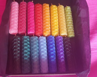 May include: A set of 18 honeycomb candles in a variety of colors, including pink, red, orange, yellow, green, blue, purple, and black. The candles are arranged in a box.