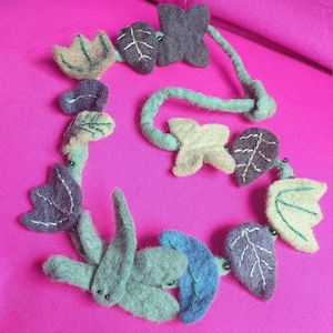 Felt necklace choker in shades of earthy greens featuring fairy festival magical pixie elf dragonflies, hand stitched green leaves & foliage