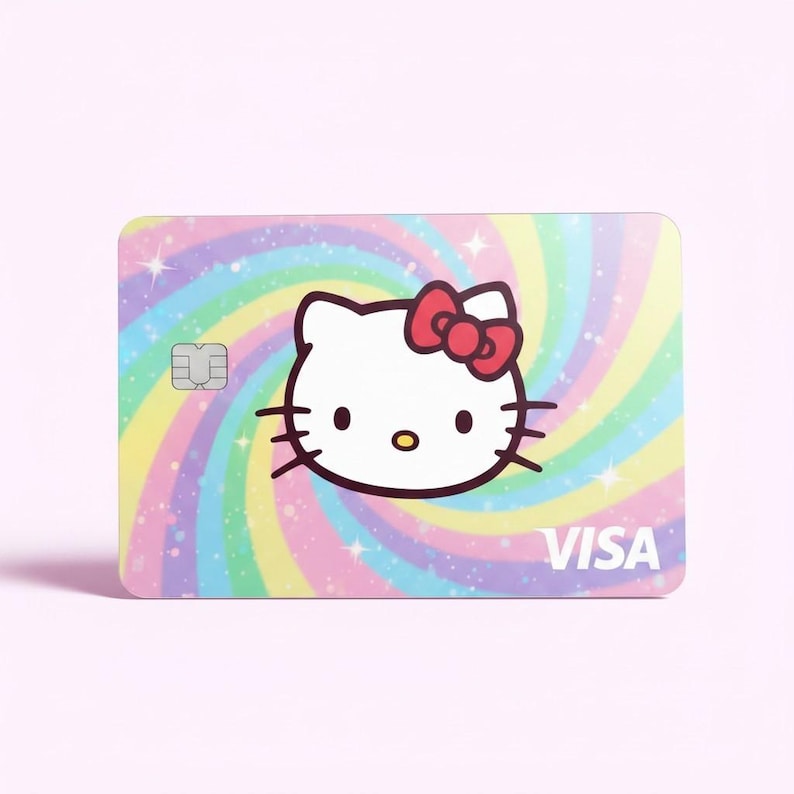 May include: A Visa credit card featuring Hello Kitty. The card has a colorful, swirling background with pastel rainbow colors. Hello Kitty's face is in the center, with a red bow. The word "VISA" is printed in the lower right corner.