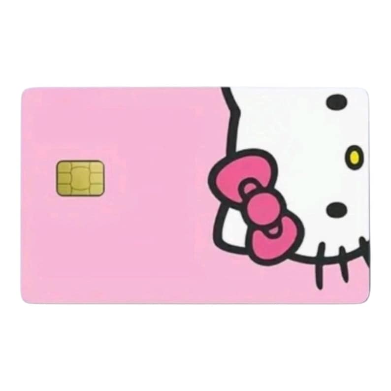 K&ouml;nnte beinhalten: Eine rosa Karte mit einem Hello Kitty-Design. Die Karte hat einen goldfarbenen Chip auf der linken Seite und einen Teil von Hello Kittys Gesicht auf der rechten Seite, einschlie&szlig;lich ihrer Schleife und schwarzen Schnurrhaare.