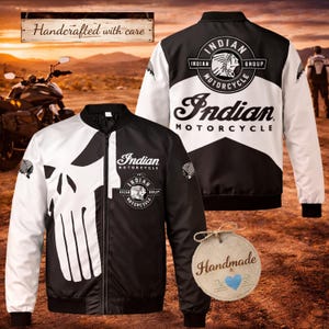 May include: Black and white bomber jacket with a skull design on the front and the words "Indian Motorcycle" on the front and back. The jacket has a zipper closure and white sleeves. The back of the jacket features the Indian Motorcycle logo.