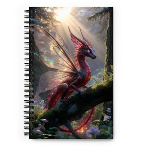 May include: Spiral-bound notebook with a fantasy illustration. A red dragon with iridescent wings and purple eyes perches on a mossy branch in a sunlit forest. The cover art showcases a detailed, whimsical design.