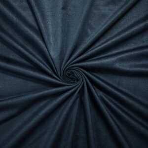 May include: A close-up shot of a dark teal fabric, with a soft, velvety texture. The fabric is arranged in a spiral, creating a swirling pattern. The folds and shadows add depth and dimension to the material, highlighting its luxurious appearance.