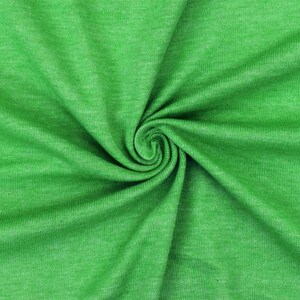 May include: Close-up of a vibrant green fabric with a spiral pattern. The fabric has a textured appearance and a slight sheen, with subtle variations in color. The material is tightly woven, suggesting a durable textile.