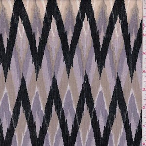 May include: Close-up of fabric with a repeating chevron pattern. The design features black, gray, and tan zigzags against a neutral background. The fabric is measured in inches.