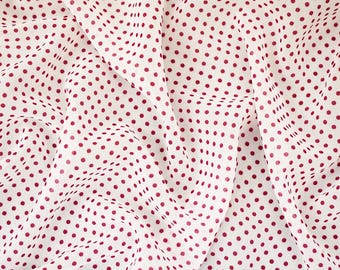May include: White fabric with a pattern of small, evenly spaced, burgundy polka dots. The fabric is draped, creating soft folds and shadows. The polka dots are consistent in size and color, providing a classic and playful design.