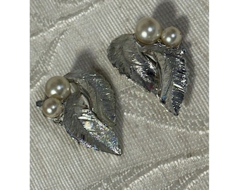Vintage 1964 Sarah Coventry "Silvery Splendor" clip-on textured earrings.