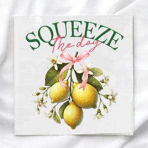 May include: A white ceramic mug with a black handle and the text "But First, Coffee" in a black, handwritten-style font. The mug is on a white surface.